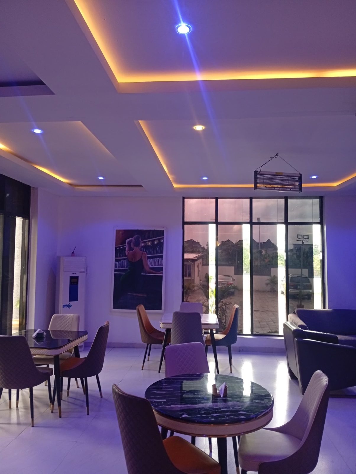 Restaurant lounge with mood lighting and marble tables