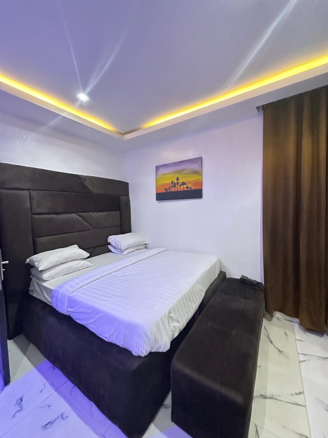 Cosy room with ambient ceiling lighting and artwork