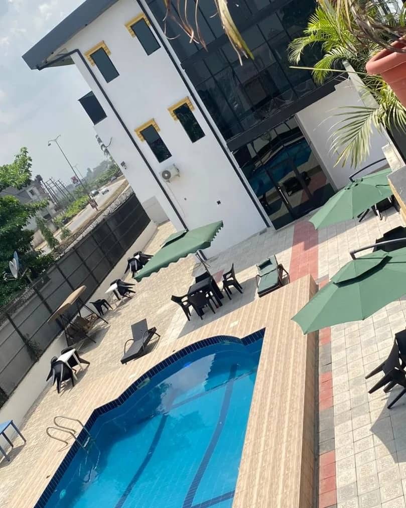 Poolside terrace with shaded lounge umbrellas