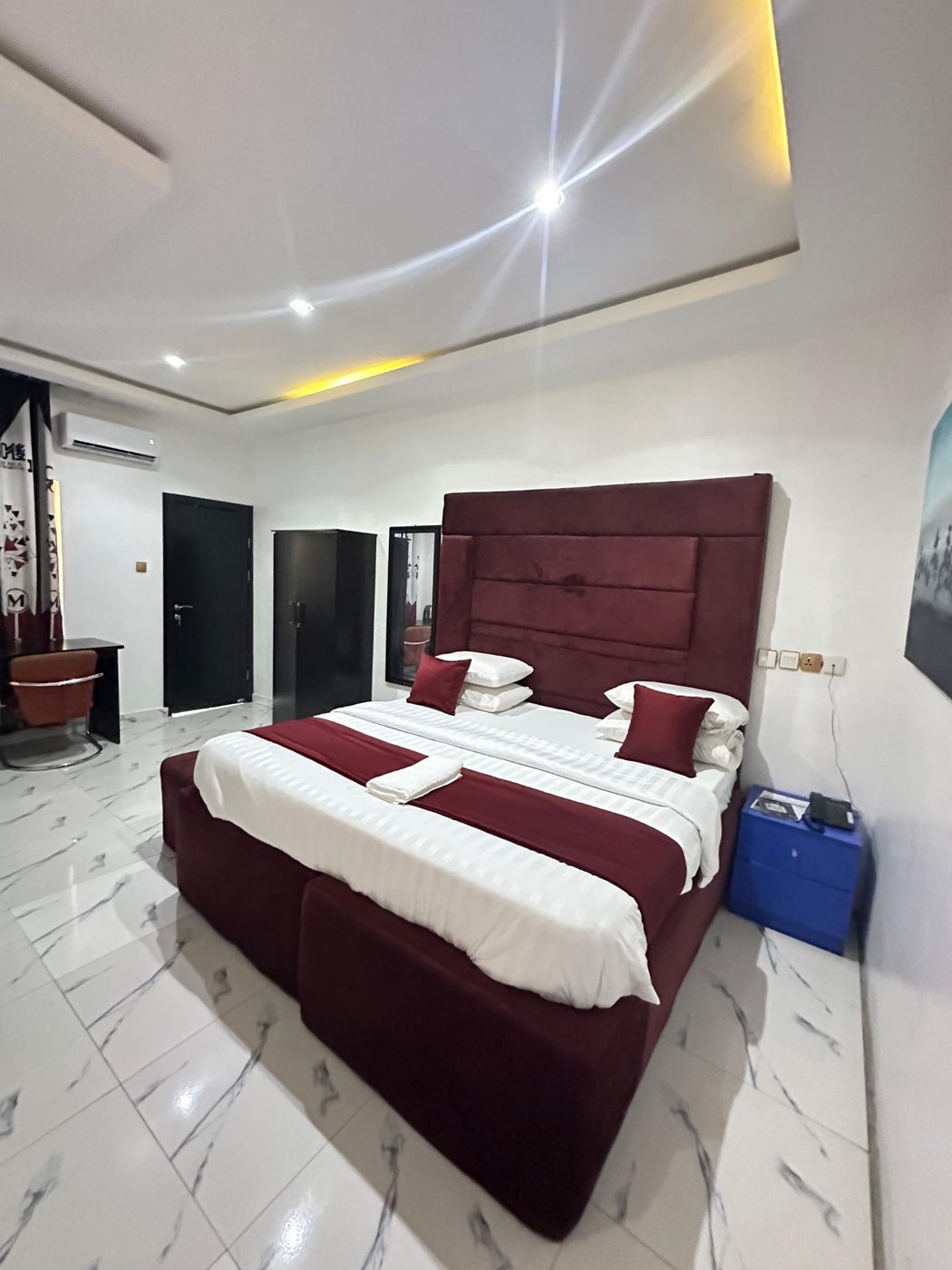 Spacious burgundy suite with work desk