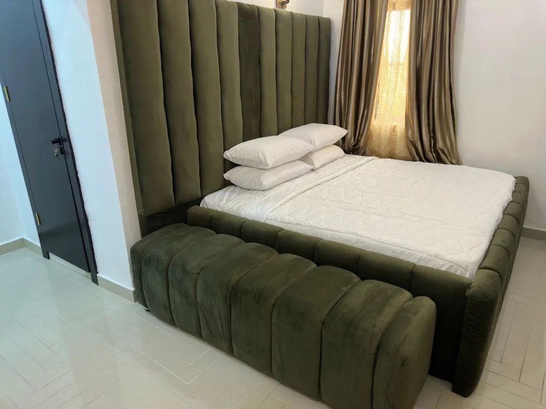 Olive green king bed with bedside bench
